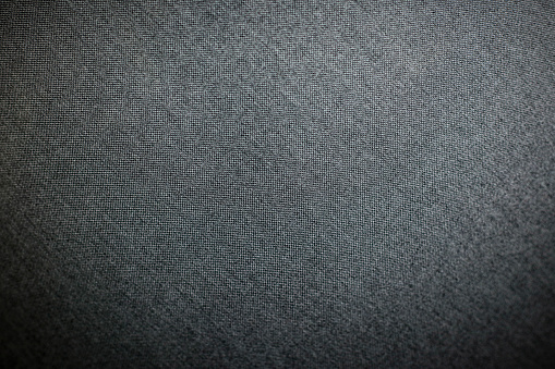 Decorative textile background with coach-type screed capitone chesterfield texture
