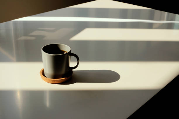 coffee cup on table photo taken in natural sunlight - ceramic light horizontal indoors imagens e fotografias de stock