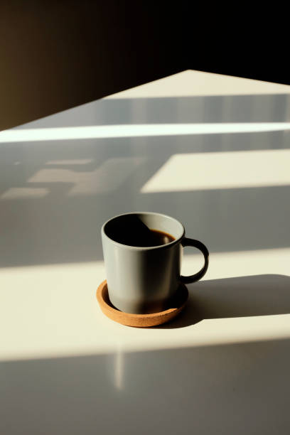 istock Coffee cup on table photo taken in natural sunlight 1184227774