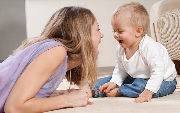 istock Mother and her baby son playing happily 118422870