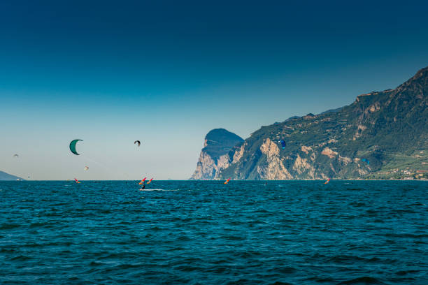 windsurfer and kitesurfer in front of Torbole in Italy.