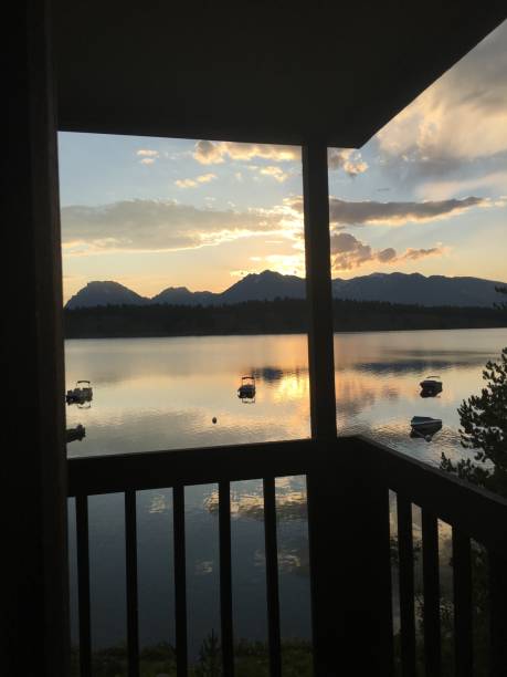 istock Relaxing on porch at sunset 1184229181