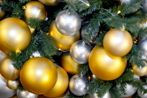 istock Gold and silver Christmas balls on Christmas tree 1184232486