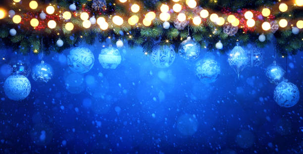 istock Christmas Tree with Decorations Light on Blue Snow Background. New Year greeting Card or Holiday Banner. 1184233346