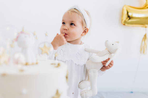 istock The child eats cake with appetite. Birthday baby. 1184234070