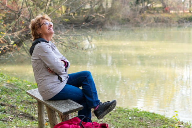 istock Senior woman enjoying in nature 1184234205