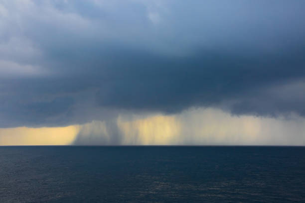 istock Rain & storms over the ocean, on a grey cloud day at sea. 1184234258