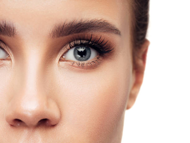 close-up woman face - skin care blue eyes expressing positivity cheerful imagens e fotografias de stock