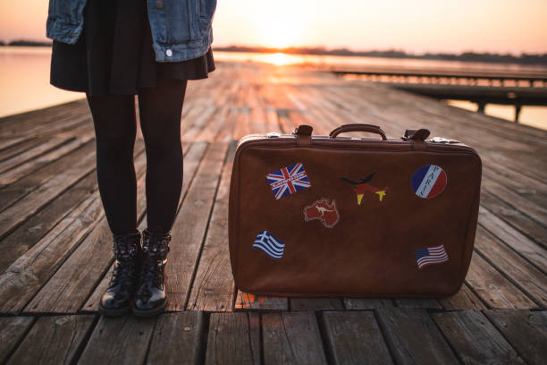 istock Suitcase near tourist 1184236277