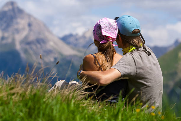 Couple  enjoying a mountains view stock photo