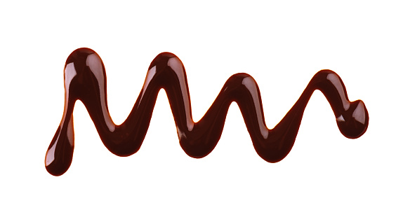 Chocolate syrup drizzle isolated on white background. Splashes of sweet chocolate sauce. Top view