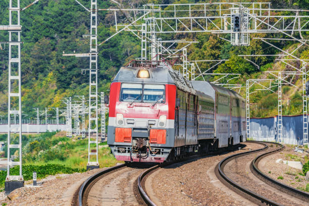 istock Passenger double deck train moves along the platform by the Black sea coast. 1184239595