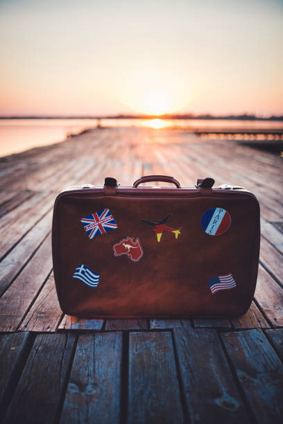 istock Retro tourist's suitcase with flag stickers 1184240848