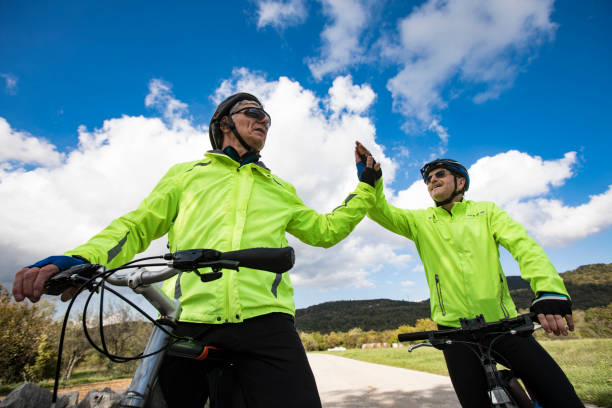 istock Senior Men Cyclers High Fiving 1184240991