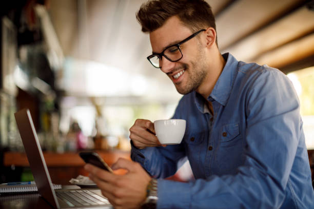 istock Young man working in coffee shop 1184241818