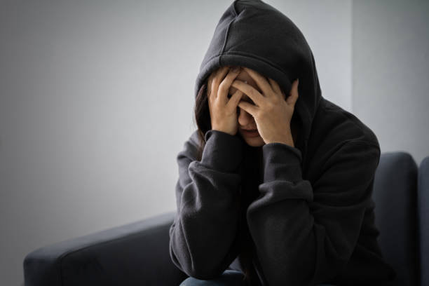 istock Stressed Woman In Hoodie 1184243080