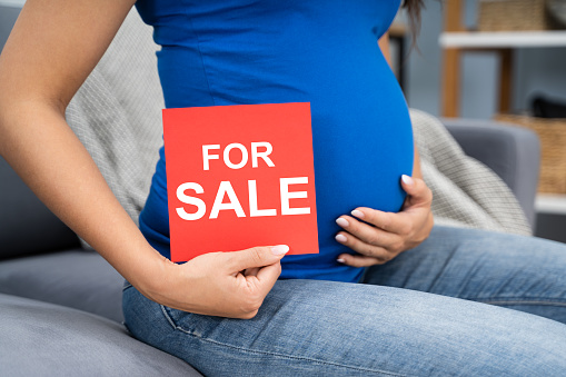 Young Pregnant Woman Offering Her Baby For Sale