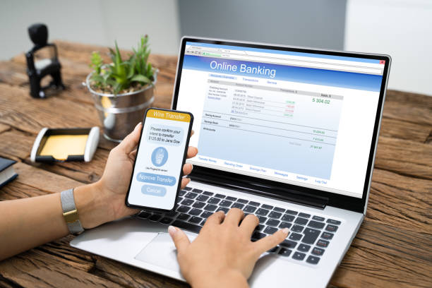 istock Woman Using Mobile Phone App To Authenthificate Bank Transfer 1184243123