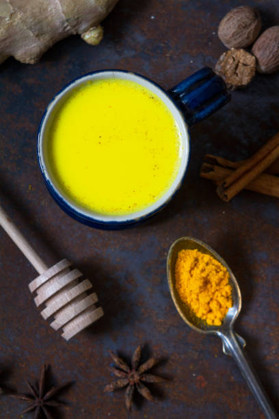 istock Turmeric golden milk in a small blue cup 1184243383