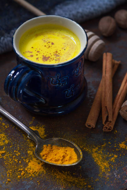 istock Turmeric golden milk in a small blue cup 1184243410