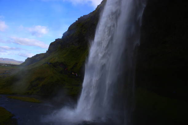istock Water drop in Iceland with tourists inside 1184244833