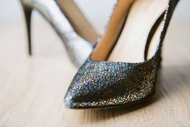 istock Black high heel women shoes isolated on table 1184247091