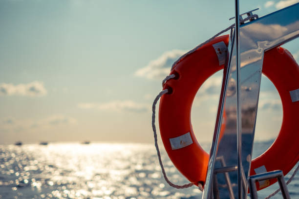 オレンジ色のライフリング - life belt nautical vessel life jacket buoy ストックフォトと画像