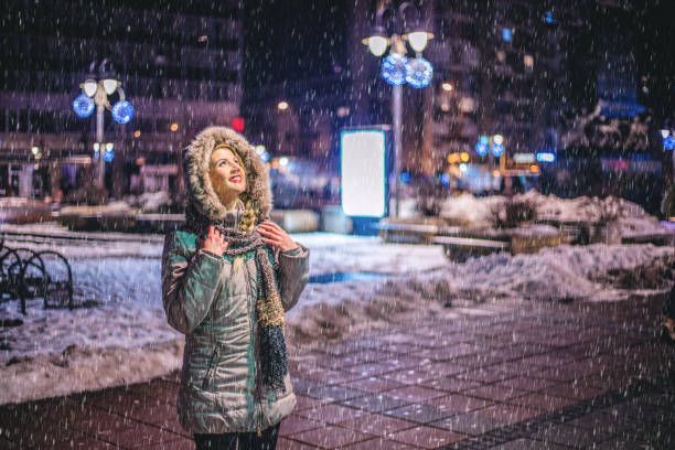 istock Woman enjoying in the winter night 1184251135