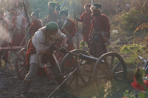 KAMYANETS-PODILSKY, UKRAINE - OCTOBER 3, 2009: Members of history club wear historical uniform 17 century during historical reenactment. Artillery Grand Duchy of Moscow, Streltsy.