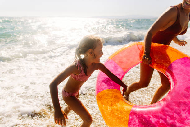 istock With mommy at the beach 1184251248
