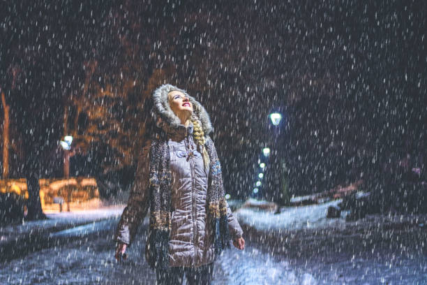 istock Woman enjoying in the winter night 1184251790