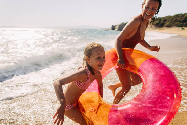 istock With mommy at the beach 1184252304