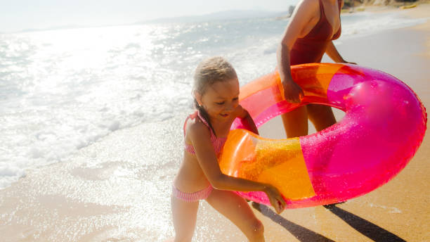 istock With mommy at the beach 1184252835
