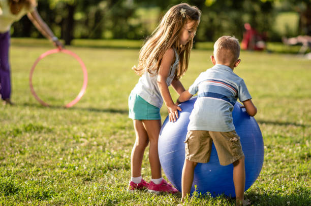 istock Children playing in public park 1184255916
