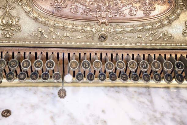 istock Gold and marble colored antique cash register 1184261056