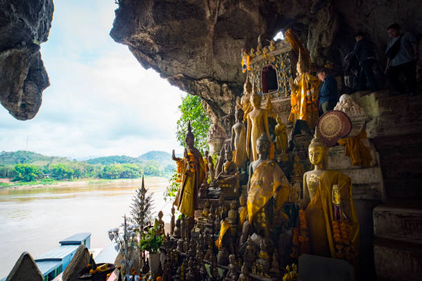 Pak Ou Caves, Luang Prabang, Laos Pak Ou Cave on the Mekong River near Luang Prabang, Laos... cave of 5000 Buddhas tam o'shanter stock pictures, royalty-free photos & images