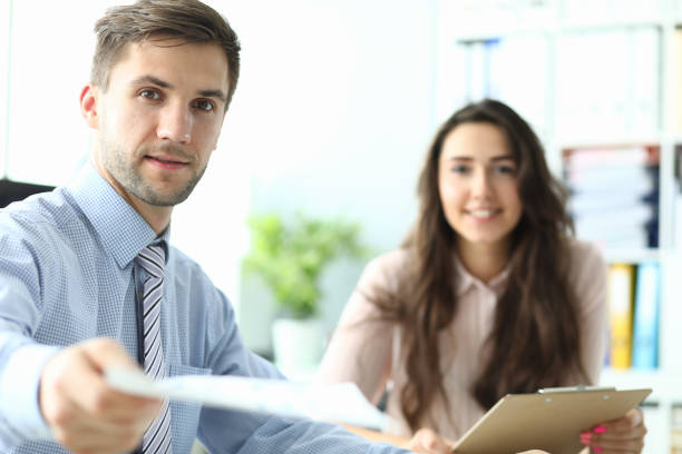 istock Businessman giving contract 1184269184