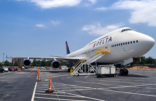 Atlanta, Georgia/ USA - June 23, 2016: A retired Delta Air Lines Boeing 747-400 sits in a vehicle parking lot outside the Delta Museum near Hartsfield–Jackson Atlanta International Airport.