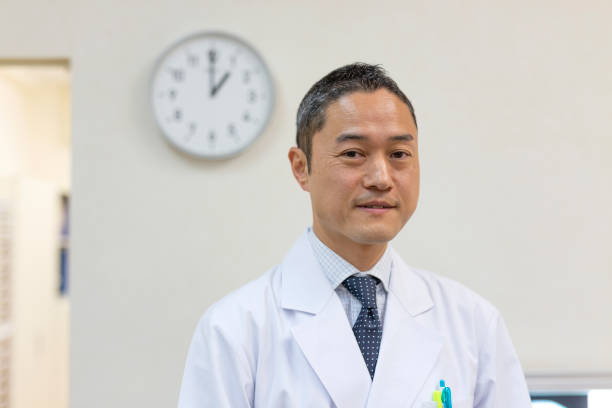 istock Portrait of a Doctor With a Clock 1184272261