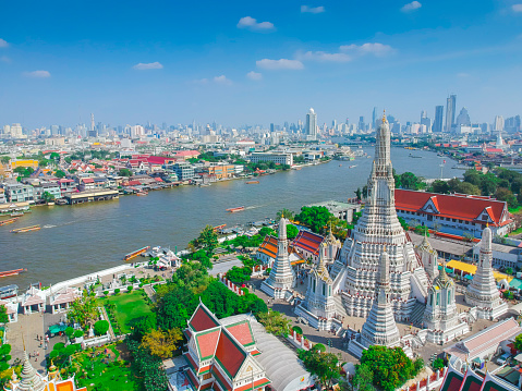 Bangkok, Thailand - September 11, 2019: outside view of Wat Arun or Wat Chaeng temple, is situated on the west bank of the Chao Phraya River. Wat Arun or temple of the dawn is partly made up of colourfully decorated spires and stands majestically over the water.