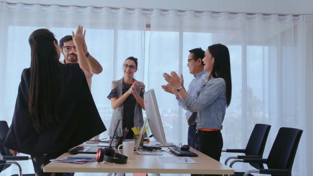 istock Successful business people celebrating success. 1184281280