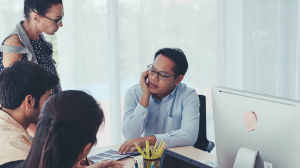 istock Unhappy business people in group meeting. 1184281295