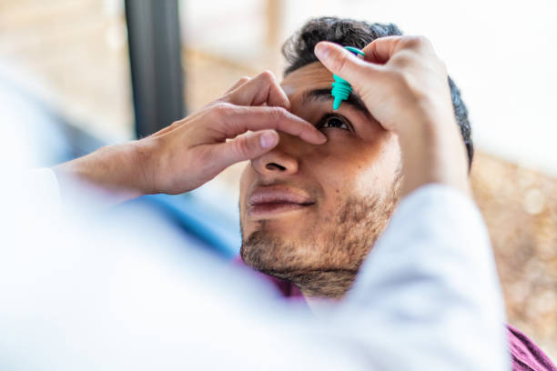 istock Eyecare Professional using high tech equipment in eyecare clinic setting part of series with millennial male and female patient in Western Colorado 1184281742