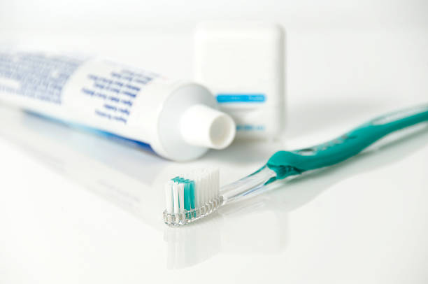 Toothbrush, Toothpaste, Floss stock photo