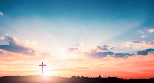 istock Christmas concept: The cross on mountain sunset background 1184283926