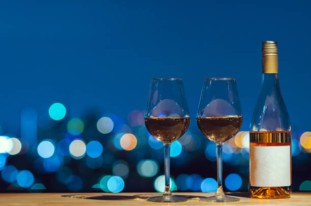 istock Two glasses and bottle of Rose wine. 1184288894