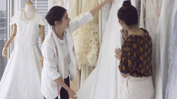 istock Future bride customer talking with wedding store shopkeeper 1184293346