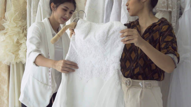 istock Future bride customer talking with wedding store shopkeeper 1184293380