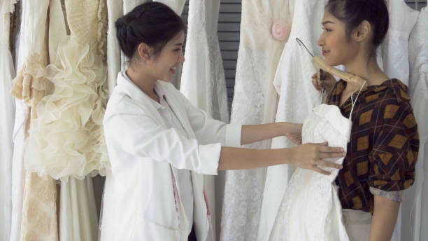 istock Future bride customer talking with wedding store shopkeeper 1184293461
