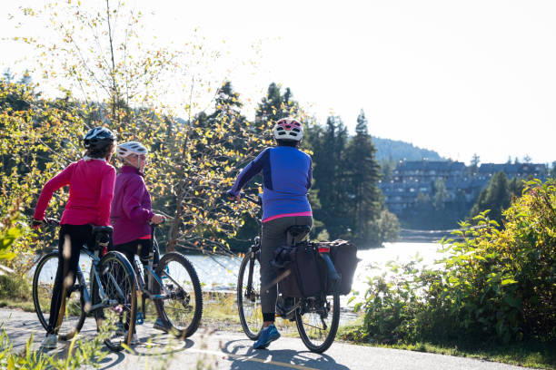 istock Active seniors cycling on a paved trail 1184294752